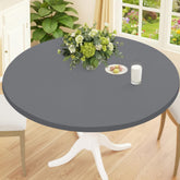 Smiry round spandex tablecloth in grey drapes smoothly for stylish indoor dining.