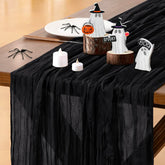 Socomi cheesecloth table runner in black at a wedding table for rustic charm.