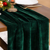 Socomi emerald velvet table runner enhances elegant holiday dining.
