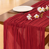 Socomi red cheesecloth table runner for wedding arches adds rustic charm.