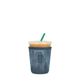 Sok It JavaSok iced coffee sleeve on foggy woods cup keeps drinks cold and hands dry.