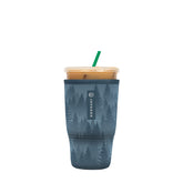 Sok It JavaSok insulated sleeve in foggy woods, front view, keeps drinks cold.