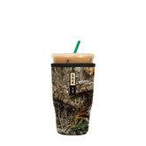 Sok It JavaSok real-tree edge camouflage sleeve keeps drinks cold and hands dry in any outdoor setting.