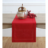 Solino Home red table runner 108in on a dining table with elegant hemstitch.