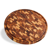 Sonder Los Angeles Vincent round cutting board on a kitchen counter with a juice groove for mess-free prep.