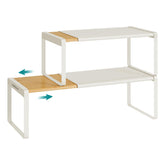Songmics Home expandable spice rack in cupboard showing adjustable width for larger spice collections