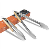 Stainless steel kitchen tongs with oak handle in 9-inch size for grilling and serving.