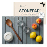 Stonevine large stone drying mat folded for tidy storage and quick kitchen reorganization.