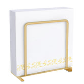 STWWO gold napkin holder on table keeps napkins neat and accessible.