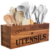 Suli Acacia wood utensil holder with four compartments keeps tools organized.
