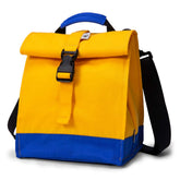 Sunny Bird rolltop lunch bag in yellow, front view for daily commuting and school lunches.