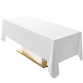 Surmente white rectangle tablecloth 60x120 draped on a dining table, enhancing ambiance.