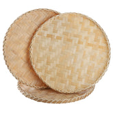 Suwimut 13-inch round bamboo tray with woven pattern for fruit and bread display.
