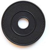 Suyika cast iron mat with rubber pegs supports hot teapots and protects surfaces.