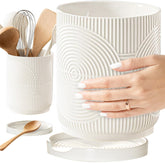 Swicken ceramic white utensil holder with concentric texture for tidy counter organization.