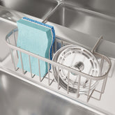 SWTYMIKI sponge holder over the sink hangs for easy drying and reach.