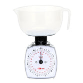 TADA 11lb analog scale dial close-up for precise ingredient measurement.