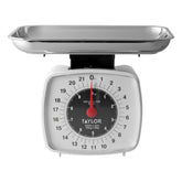 Taylor analog kitchen scale dial close-up for quick, accurate readings.
