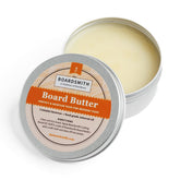 The Boardsmith Cutting Board Butter jar on a wooden counter provides easy wood conditioning.