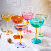 The Wine Savant hand-blown colored coupe glasses for vibrant cocktails and celebrations.