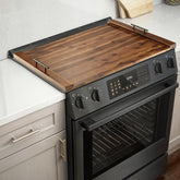 Tidita Acacia stove top cover in walnut adds extra prep space on the kitchen counter.