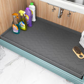 TigeJoy under-sink mat with waterproof edge protecting kitchen cabinets from spills