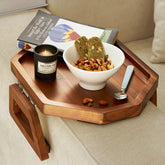 Tinamo octagonal acacia sofa arm tray close-up shows durable wood and elegant grain.