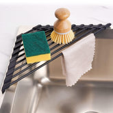 Tomorotec triangle roll-up drying rack for compact corner drying of dishes.