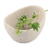 Trasylph Pottery Herb Stripper Bowl showing leaves being peeled from stems for quick prep.