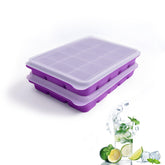 Tvmania ice cube trays with lids releasing perfect cubes for cocktails and cold drinks.