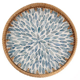 Tynulox round rattan tray with mother-of-pearl inlay and light blue leaves for elegant table decor.