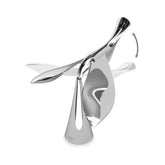 Umbra Tipsy bottle opener balances on its stand for stylish display.