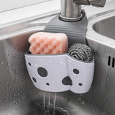 UNIKON sink caddy around faucet holds sponges and brushes for quick access