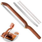 Uprichya bread knife with curved blade slicing crusty bread smoothly
