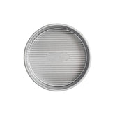 USA Pan 6-inch round cake pan top view highlights fluted surface for even browning