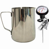 UZER milk frothing pitcher with thermometer pen for precise steaming and latte art.