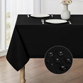 Veblandy rectangle tablecloth with waterproof finish protects a dining table during meals.