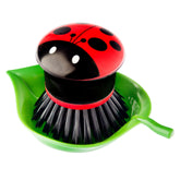 Vigar Ladybug palm dish scrub brush tackles grease while protecting delicate surfaces.