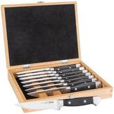 Viking 8-piece steak knife set in wood box with serrated blades for easy carving.