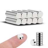Vruelia 100-pack magnets in 8x3mm size holding a chart on the fridge.