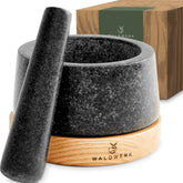 WALDWERK mortar and pestle with oak base on counter protecting surfaces.