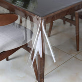 Walrus clear vinyl tablecloth protector on a dining table for spill protection.