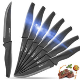 Wanbasion black non-serrated steak knives set blade closeup showing sharp edge and rust-resistant finish.