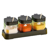 WANYISHUN condiment jars with lids and spoons set on a tray for organized kitchen storage.