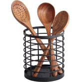 WDT Tool utensil holder on counter keeps spatulas organized and accessible.