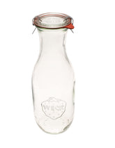WECK 766 juice jars 3-pack on counter, ideal for fresh juice prep and rustic brunch display.