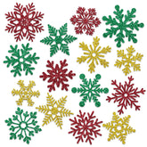 Whaline snowflake magnets set on a fridge in red, green and gold for festive kitchen decor