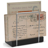 Wican mail holder on bamboo-iron tabletop keeps mail organized and accessible.