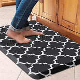 WISELIFE anti-fatigue kitchen mat with cushioned surface supports comfortable standing at the sink.