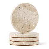 WORHE travertine coaster (round, top view) with cork backing protects surfaces.